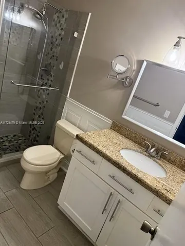 a view of room with wooden floor