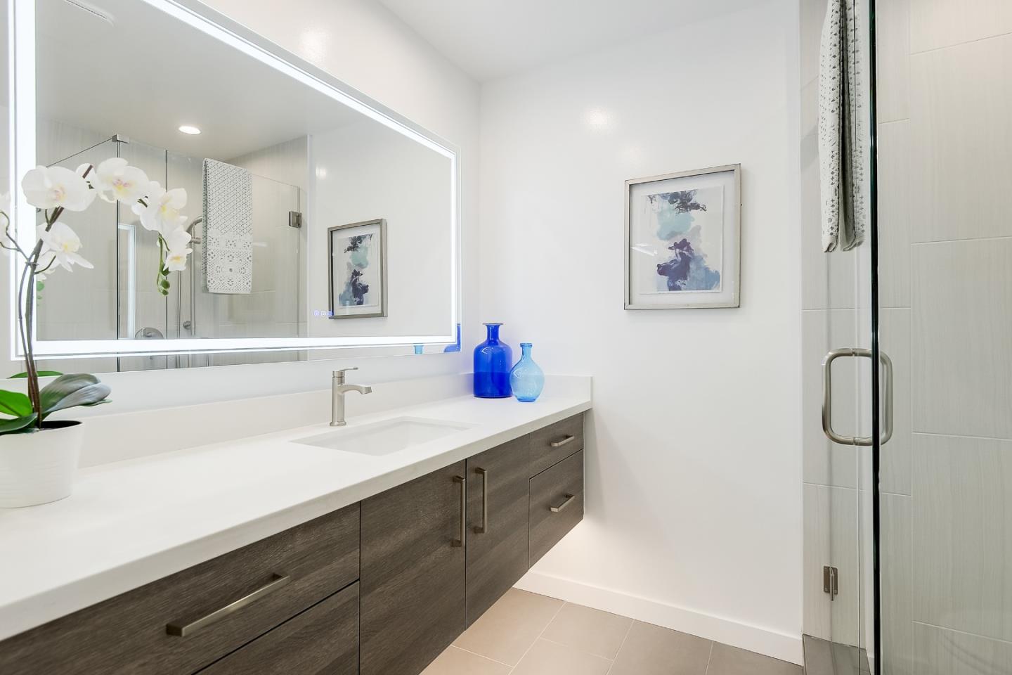 21 Willow Road, Unit 24 Menlo Park, CA 94025 - Photo 16 of 22 a bathroom with a sink and a mirror