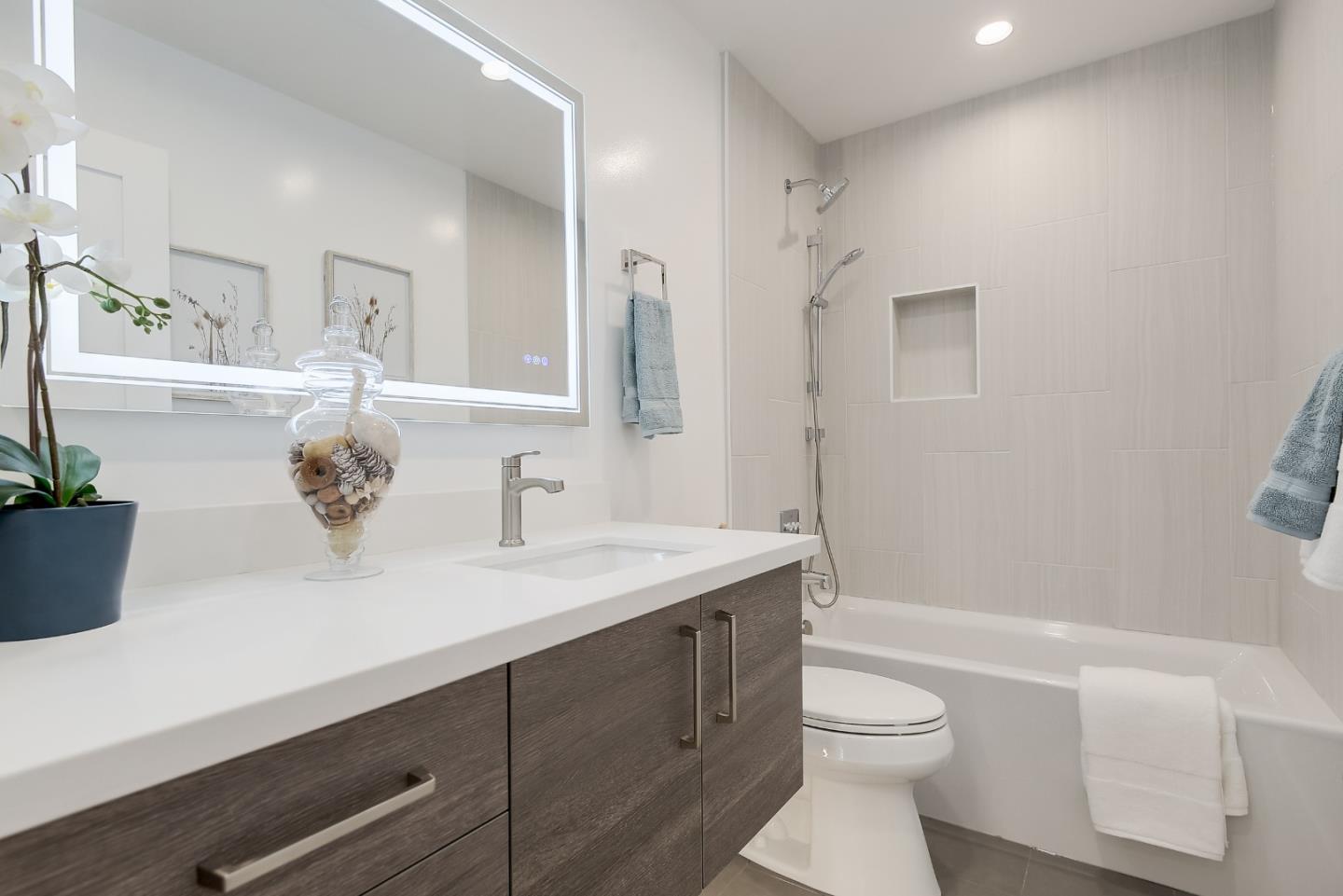 21 Willow Road, Unit 24 Menlo Park, CA 94025 - Photo 17 of 22 a bathroom with a double vanity sink toilet and shower
