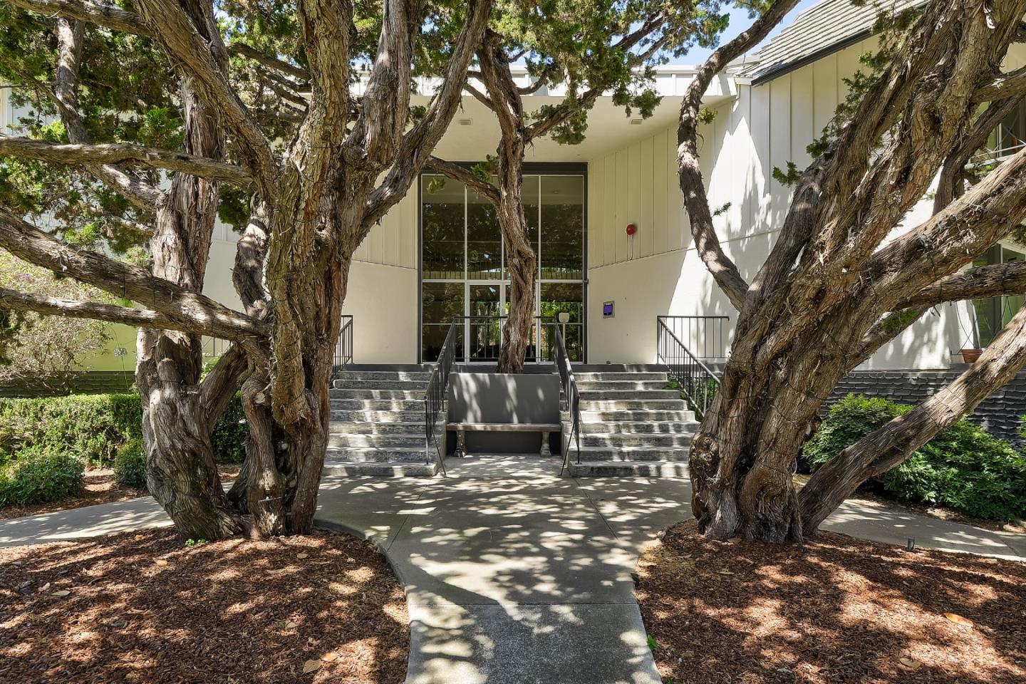 21 Willow Road, Unit 24 Menlo Park, CA 94025 - Photo 19 of 22 a front view of a house with a garden