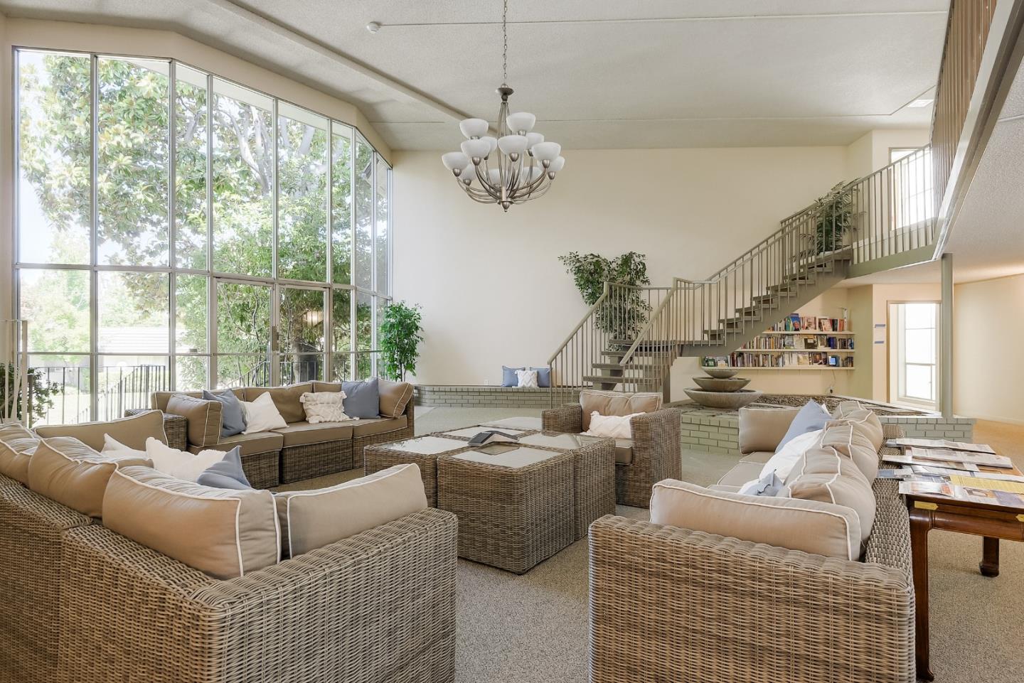 21 Willow Road, Unit 24 Menlo Park, CA 94025 - Photo 21 of 22 a living room with furniture and a large window
