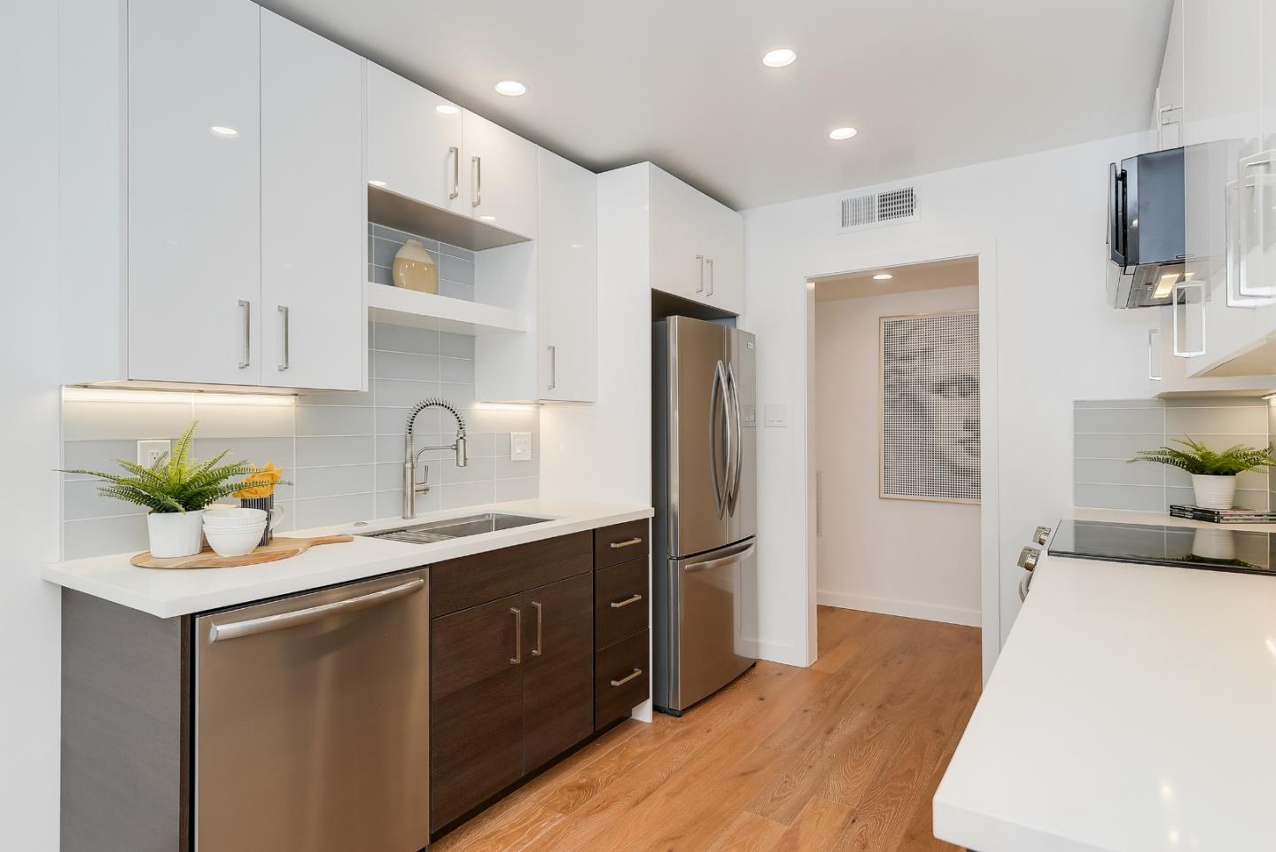 21 Willow Road, Unit 24 Menlo Park, CA 94025 - Photo 6 of 22 a kitchen with kitchen island a sink stainless steel appliances and cabinets