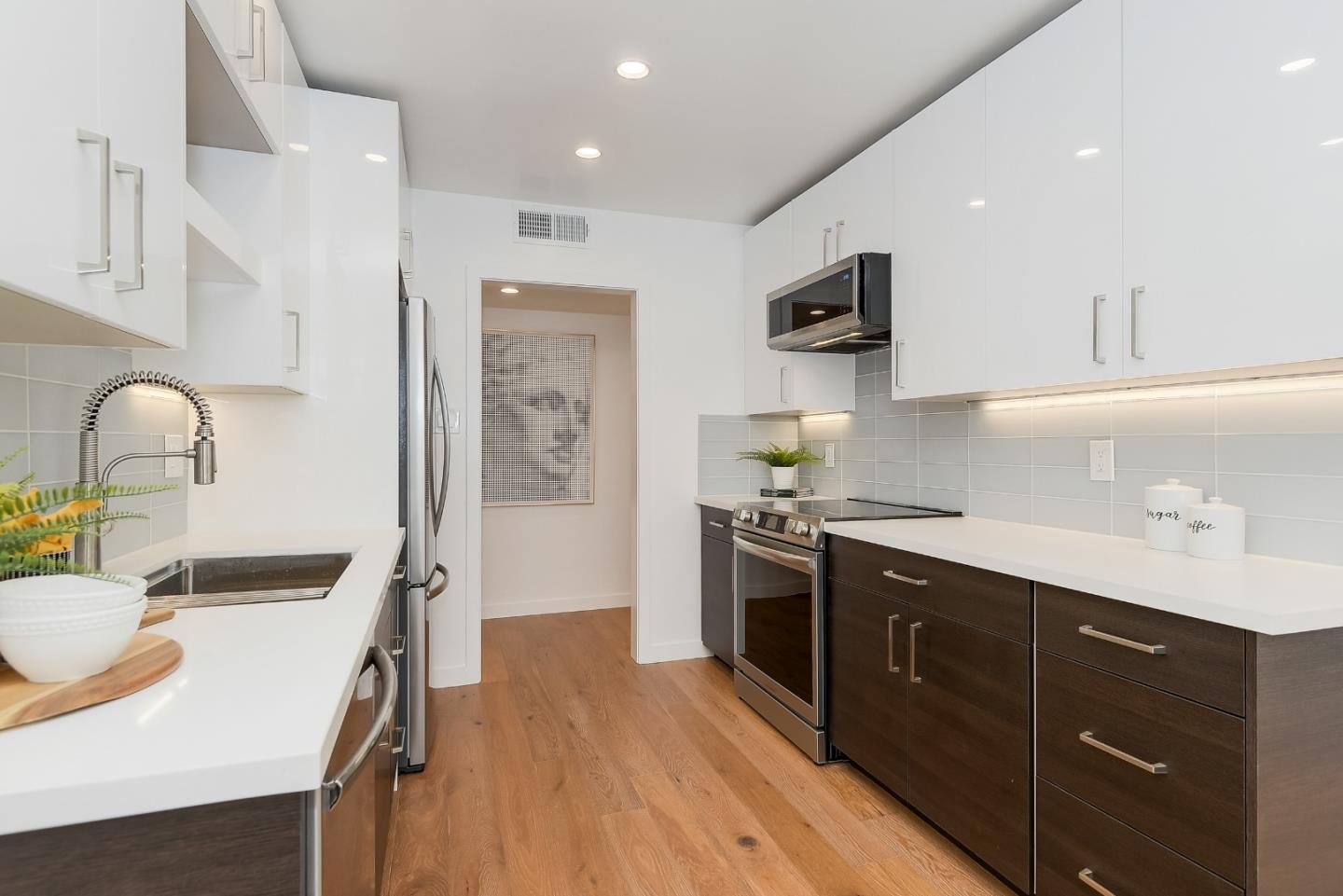 21 Willow Road, Unit 24 Menlo Park, CA 94025 - Photo 9 of 22 a kitchen with stainless steel appliances granite countertop a sink stove and refrigerator