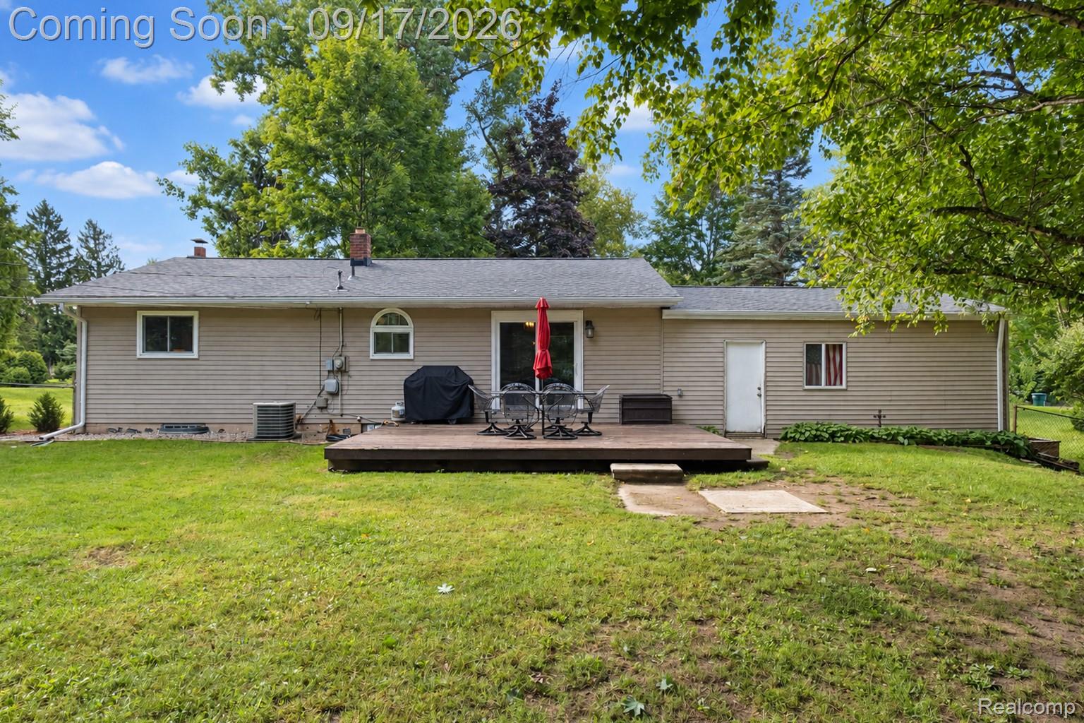 3294 Genoa Road Clarkston, MI 48346 - Photo 16 of 23 Exterior featuring horizontal siding, a wooden deck, and a sliding glass door