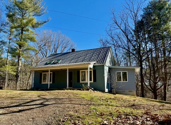 a house with trees in front of it