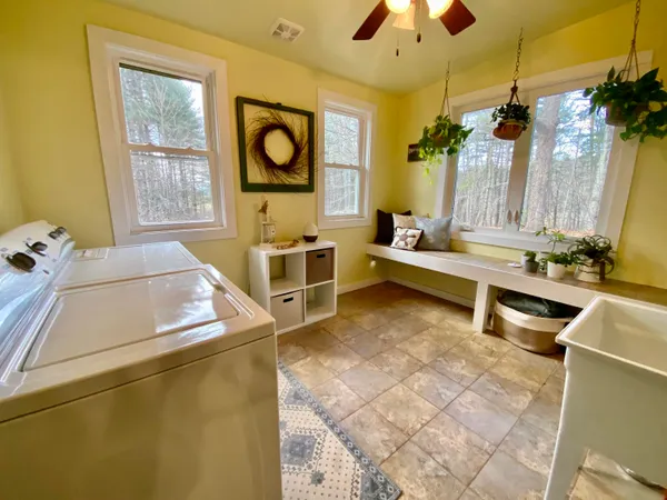 a living room with furniture and flat screen tv
