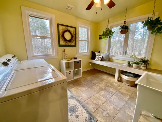 a living room with furniture and flat screen tv