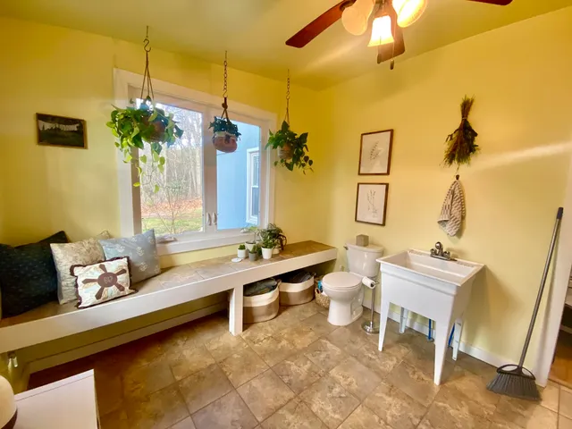 a living room with a couch and a chandelier