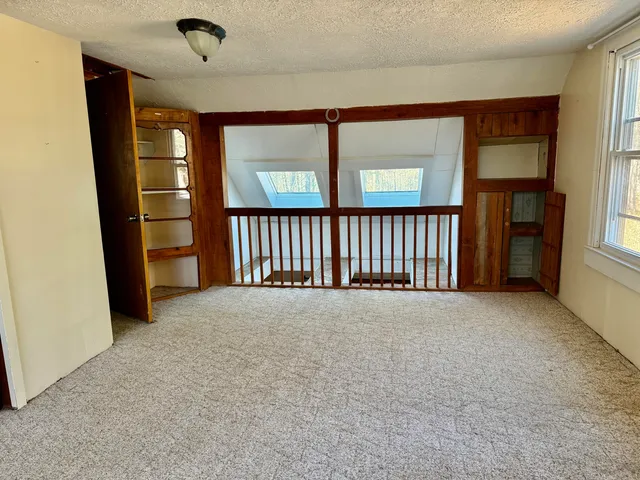 a view of livingroom with furniture and large window