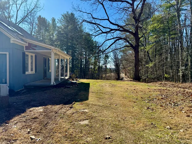 a view of snow on the side of road