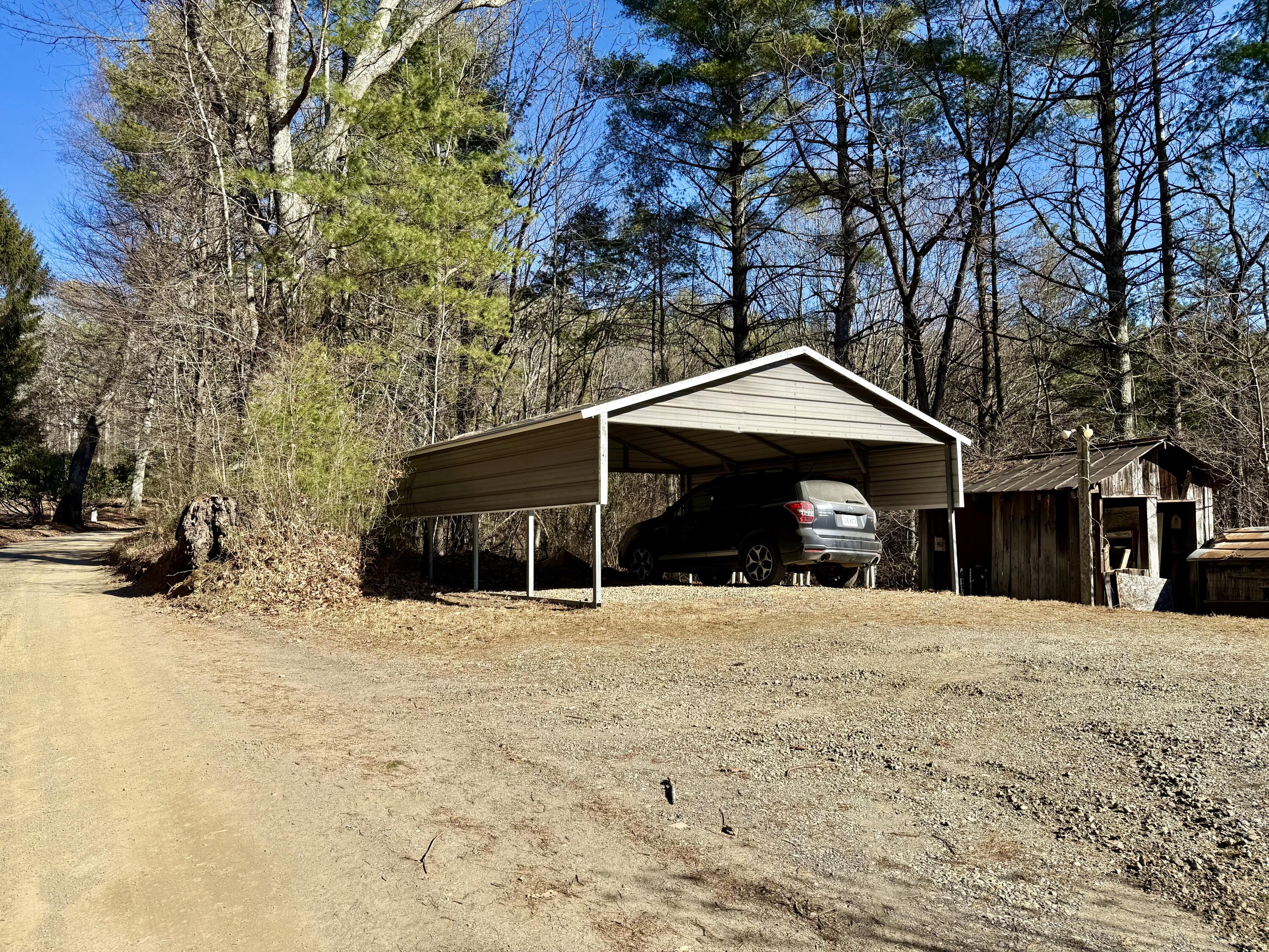 545 Slaughter Hill Road Northwest Indian Valley, VA 24105 - Photo 26 of 31 a front view of a house with a yard covered in snow