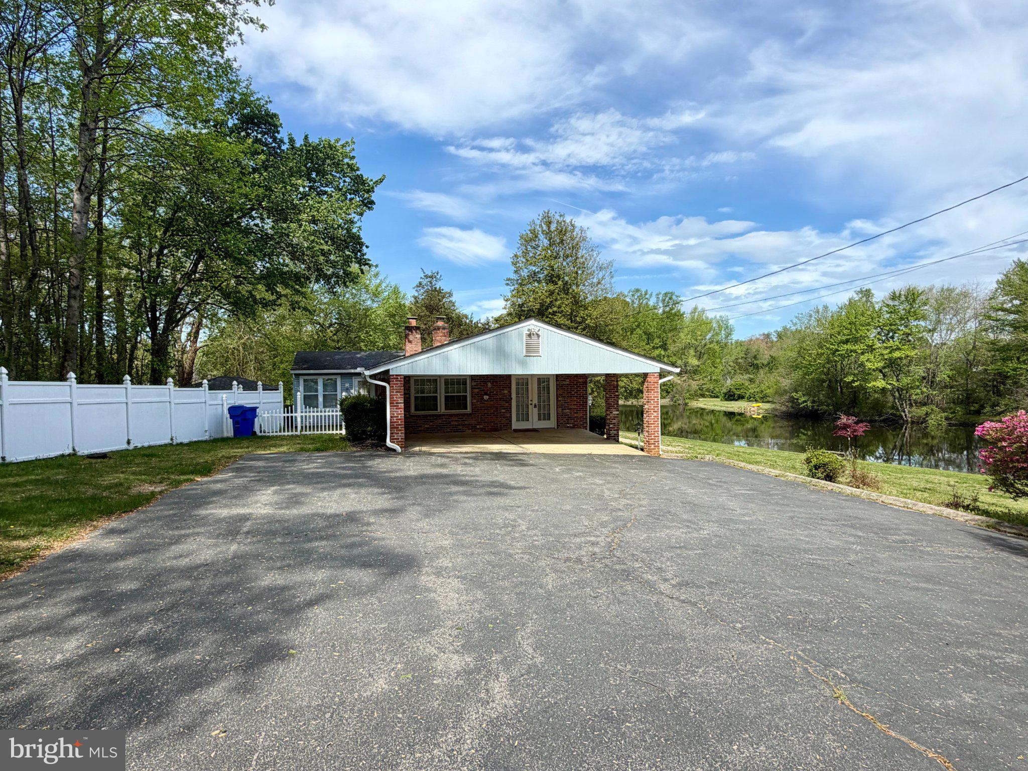 6109 Cracklingtown Road Hughesville, MD 20637 - Photo 12 of 25 a front view of a house with a yard