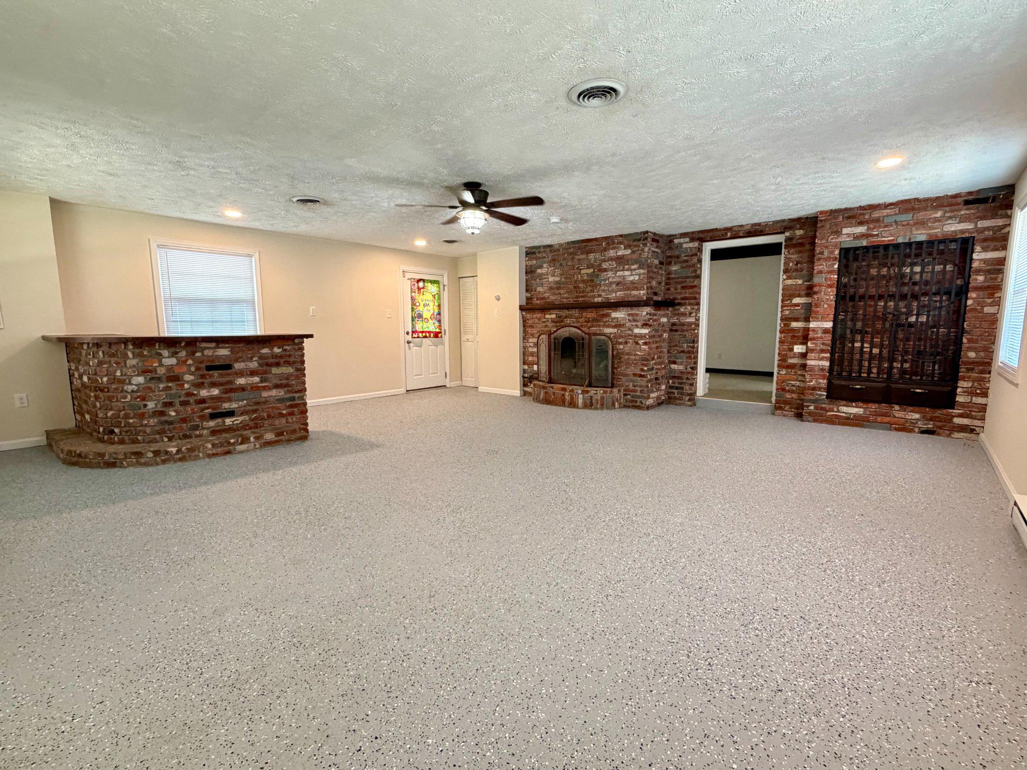 6109 Cracklingtown Road Hughesville, MD 20637 - Photo 13 of 25 an empty room with furniture and a fireplace