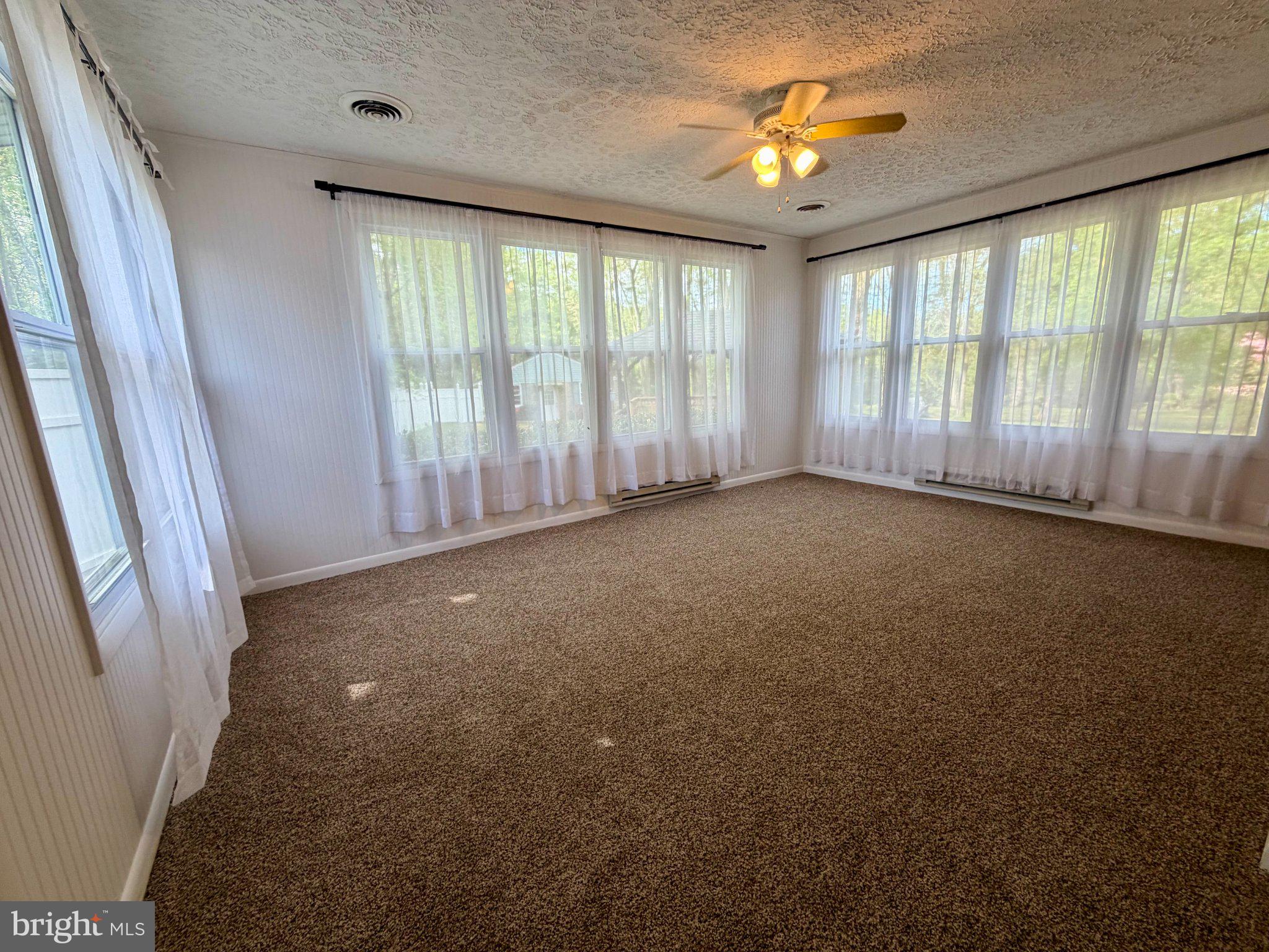 6109 Cracklingtown Road Hughesville, MD 20637 - Photo 16 of 25 a view of room with window and a ceiling fan