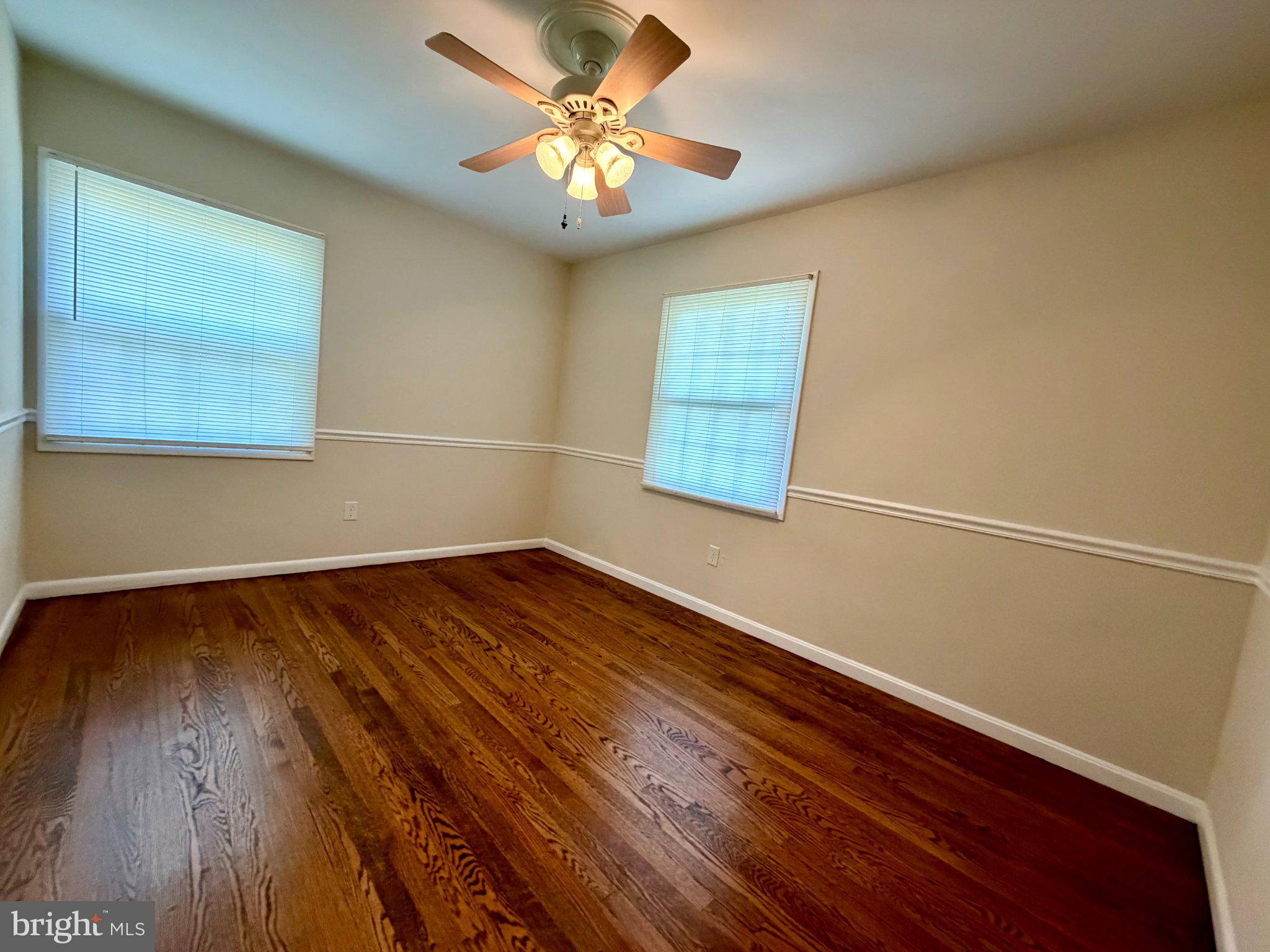 6109 Cracklingtown Road Hughesville, MD 20637 - Photo 17 of 25 a view of room with wooden floor and fan