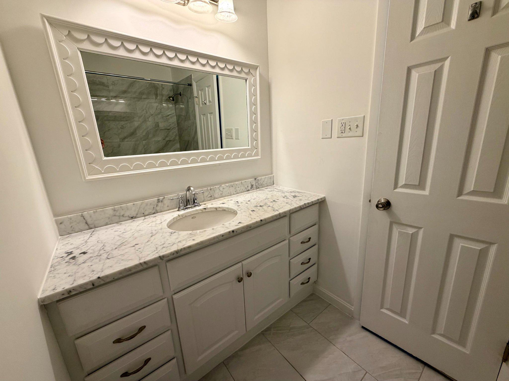 6109 Cracklingtown Road Hughesville, MD 20637 - Photo 18 of 25 a bathroom with a granite countertop sink and mirror