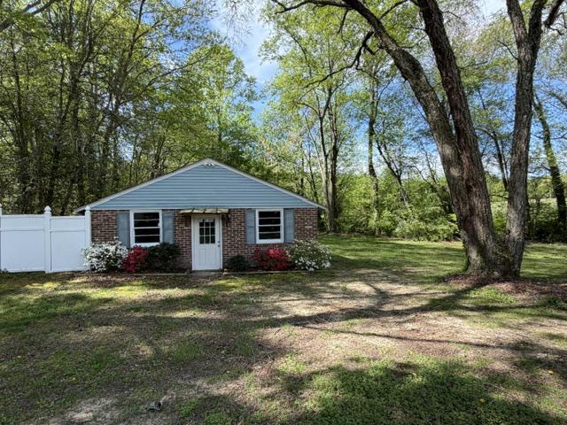 6109 Cracklingtown Road Hughesville, MD 20637 - Photo 23 of 25 a view of a yard in front of a house with large trees