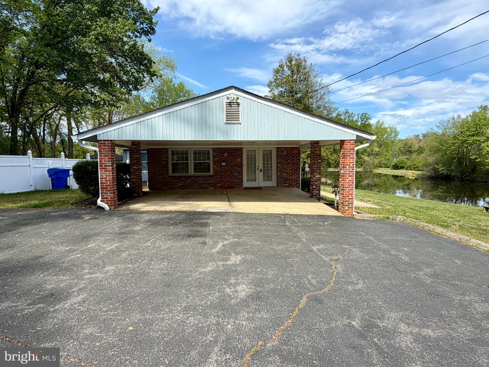 6109 Cracklingtown Road Hughesville, MD 20637 - Photo 24 of 25 a view of a house with a yard and roof