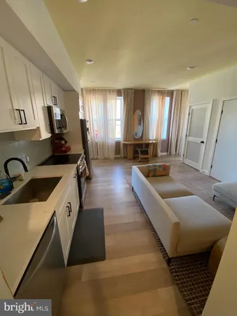 a large kitchen with a large window