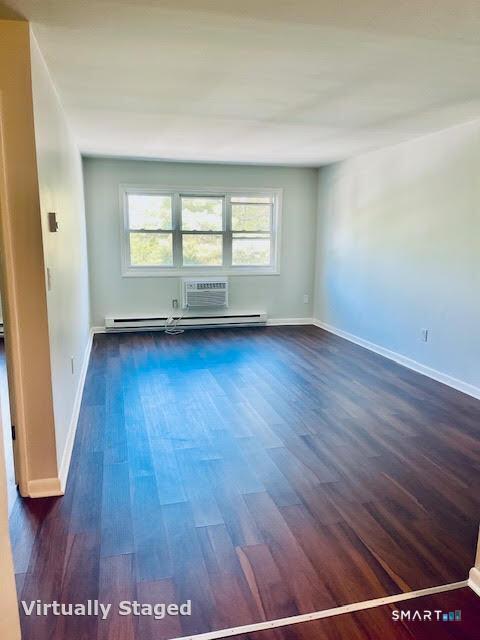 45 Monroe Street, Unit B8 Bridgeport, CT 06605 - Photo 12 of 14 an empty room with wooden floor and windows