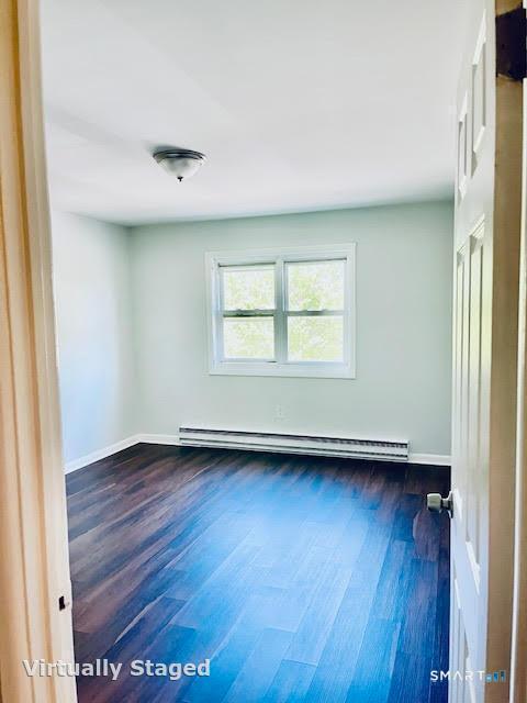 45 Monroe Street, Unit B8 Bridgeport, CT 06605 - Photo 3 of 14 an empty room with wooden floor and windows