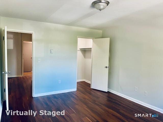 45 Monroe Street, Unit B8 Bridgeport, CT 06605 - Photo 5 of 14 a view of an empty room with wooden floor