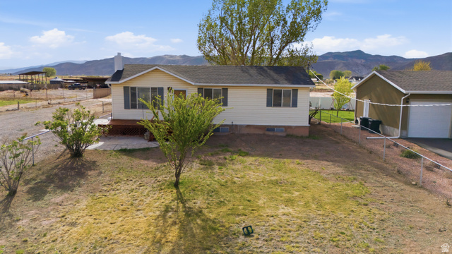 337 North Main Street Central Valley, UT 84754 - Photo 1 of 40 Ranch-style home featuring a mountain view and a fenced backyard