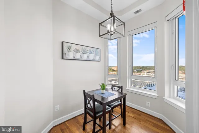 a spacious bedroom with a bed and large windows
