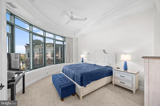 a bathroom with a sink mirror vanity and toilet