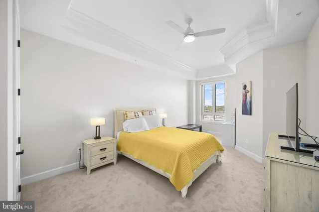 a spacious bathroom with a sink a toilet a shower and a mirror