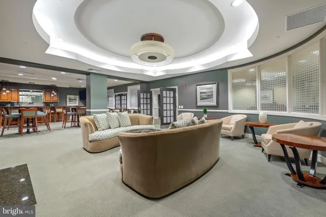 a view of livingroom with furniture and natural light