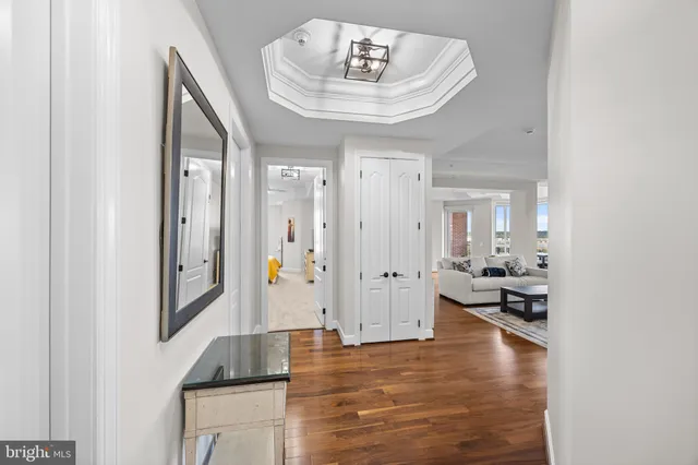 a living room with kitchen island furniture and a wooden floor