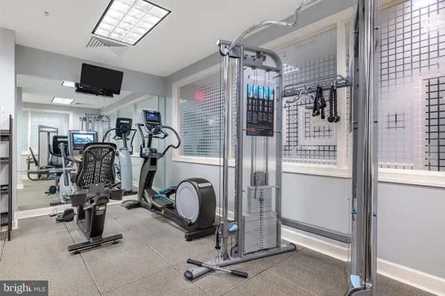 a kitchen with stainless steel appliances granite countertop a sink and a refrigerator