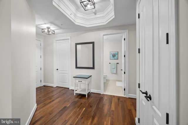 a living room with furniture or couch and a wooden floor