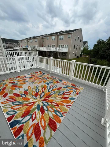 a view of balcony with wooden floor