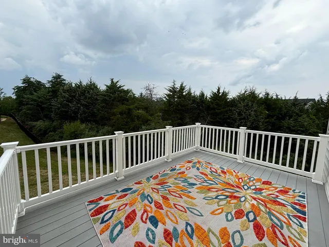 a kitchen with stainless steel appliances wooden floors and wooden cabinets