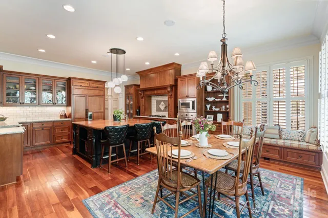 a living room with a bed furniture and a large window