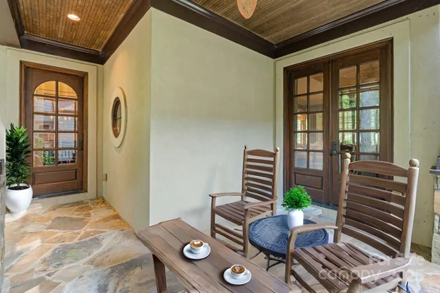 a bathroom with a granite countertop double vanity sink and mirror