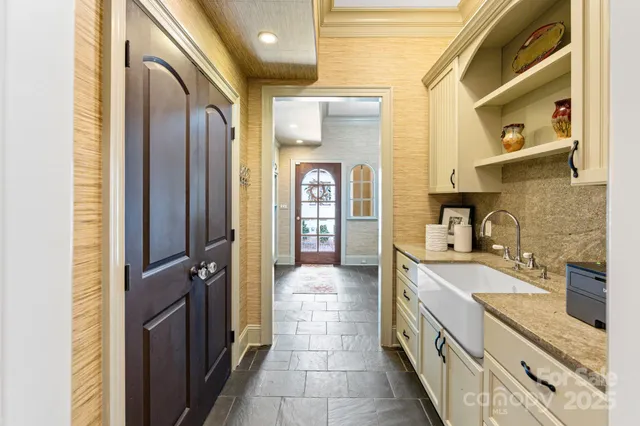 a spacious bedroom with a large bed and a window