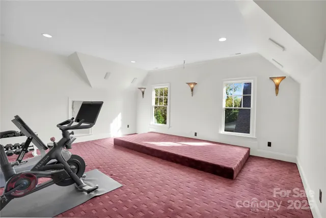 a bathroom with a granite countertop sink a mirror and shower