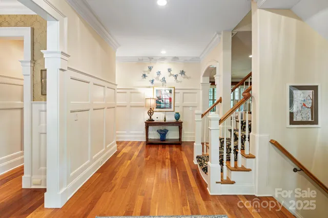 a bathroom with a granite countertop sink a mirror and a shower