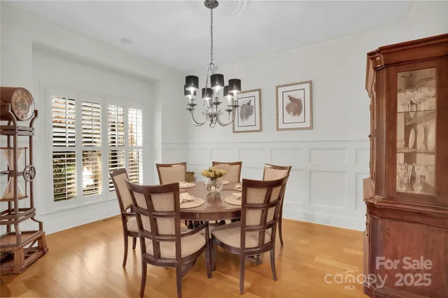 a living room with furniture and a view of kitchen