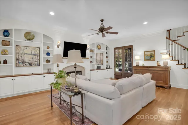 a balcony with furniture and a potted plant