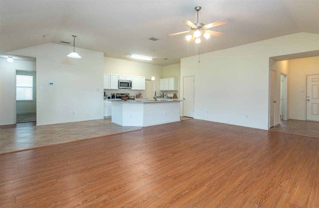 107 Hazelnut Trail Forney, TX 75126 - Photo 8 of 37 Open Family room and kitchen with island.