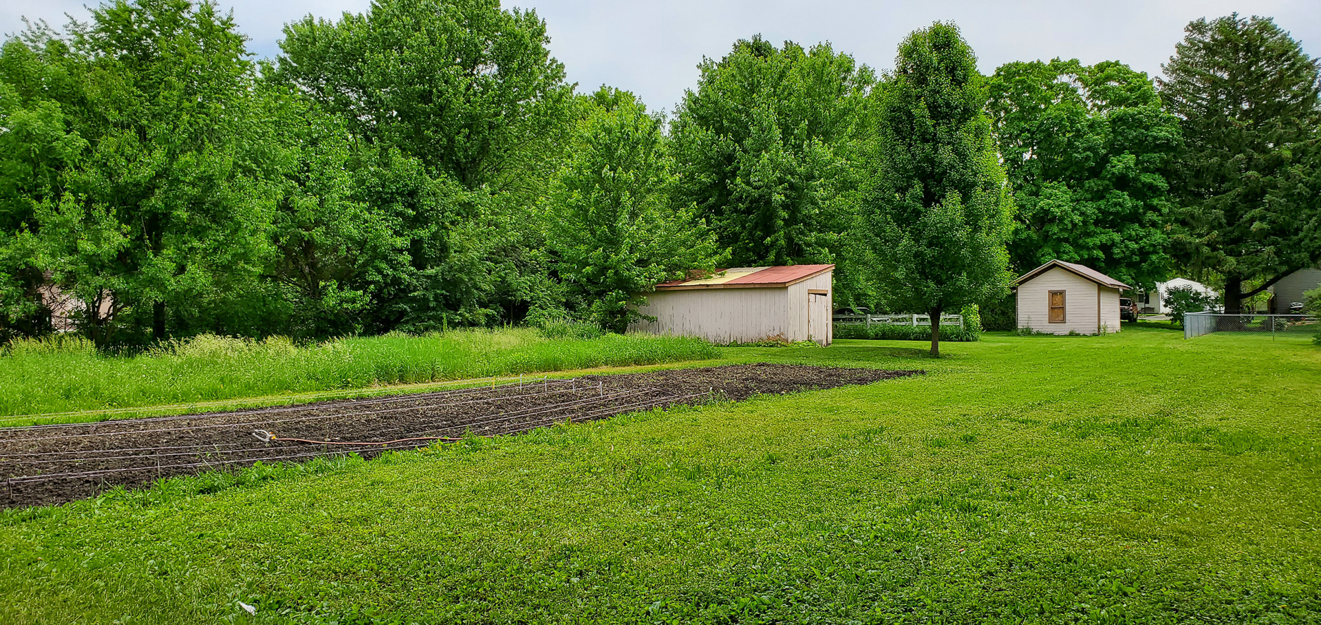 205 North Grove Street Normal, IL 61761 - Photo 7 of 13 a view of a house with backyard and garden