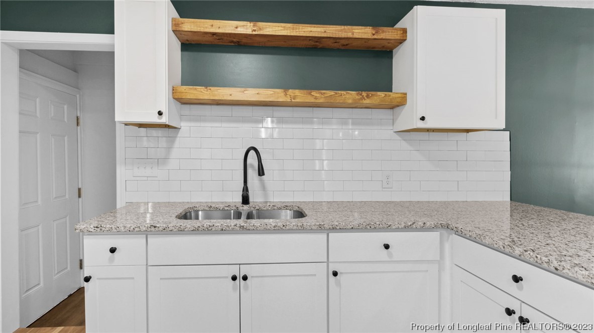 5867 Columbine Road Fayetteville, NC 28306 - Photo 11 of 26 a bathroom with a sink and vanity