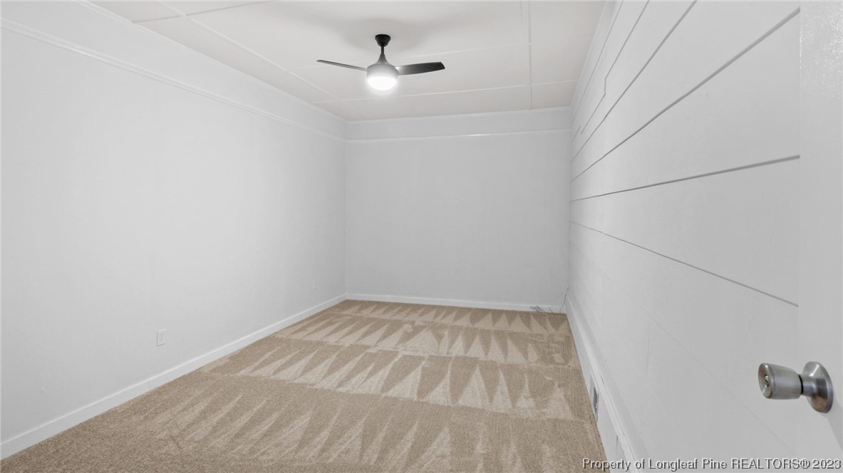 5867 Columbine Road Fayetteville, NC 28306 - Photo 15 of 26 a view of empty room with ceiling fan