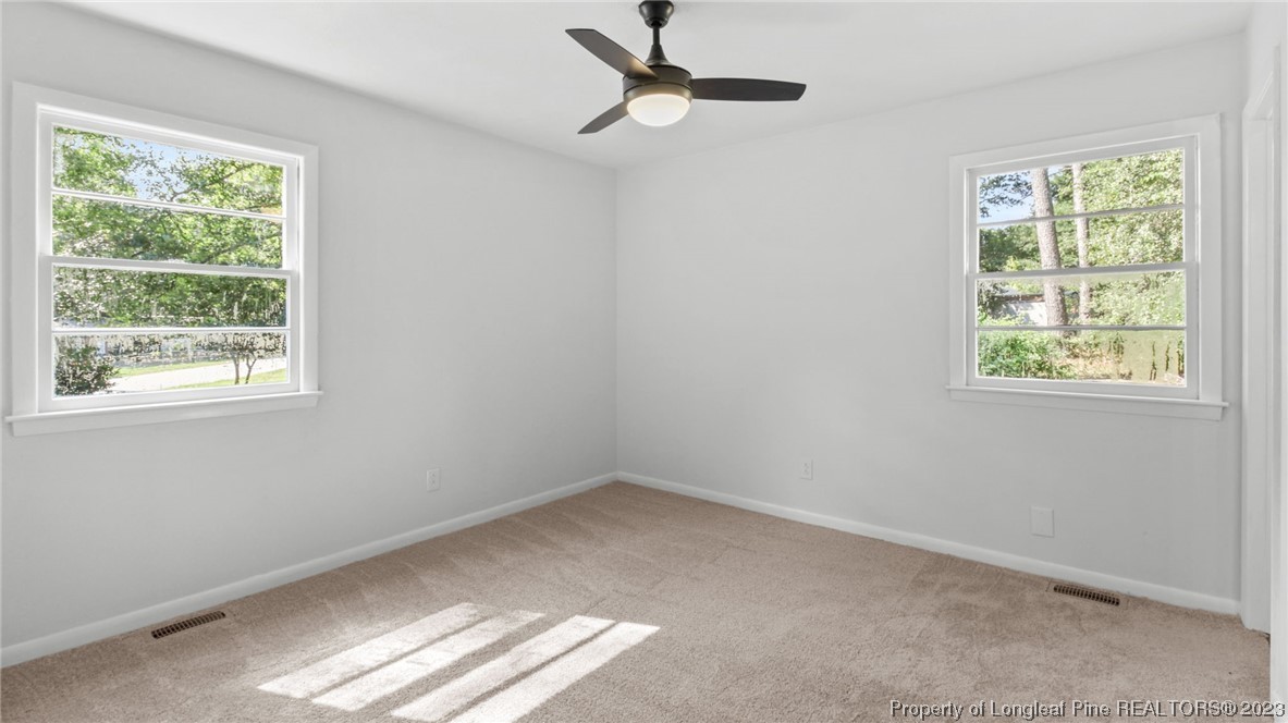 5867 Columbine Road Fayetteville, NC 28306 - Photo 21 of 26 a view of room with window and ceiling fan