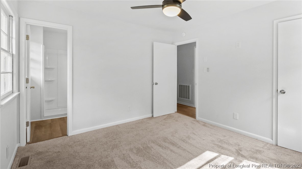 5867 Columbine Road Fayetteville, NC 28306 - Photo 22 of 26 a view of a room with wooden floor