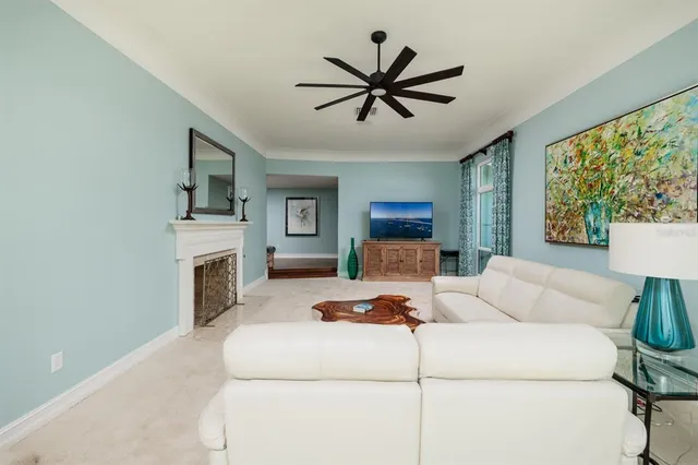 a living room with furniture and a fireplace